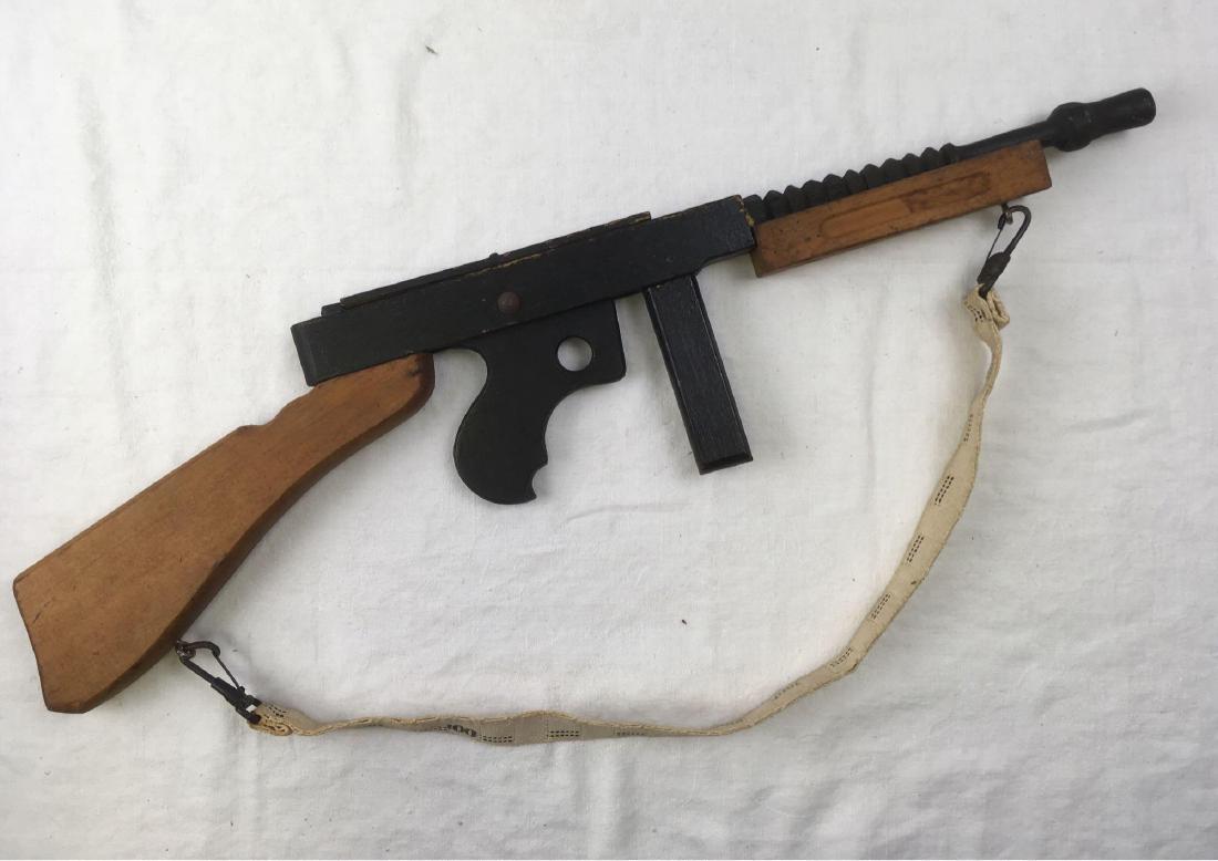Rare Wooden Toy "Hell-Raiser" Thompson Sub Machine Gun: Rare Wooden Toy "Hell-Raiser" Thompson Sub Machine Gun; a very interesting piece, it appears to be a production piece with much hand work. All parts are solid wood, there is no plywood. We judge this 
