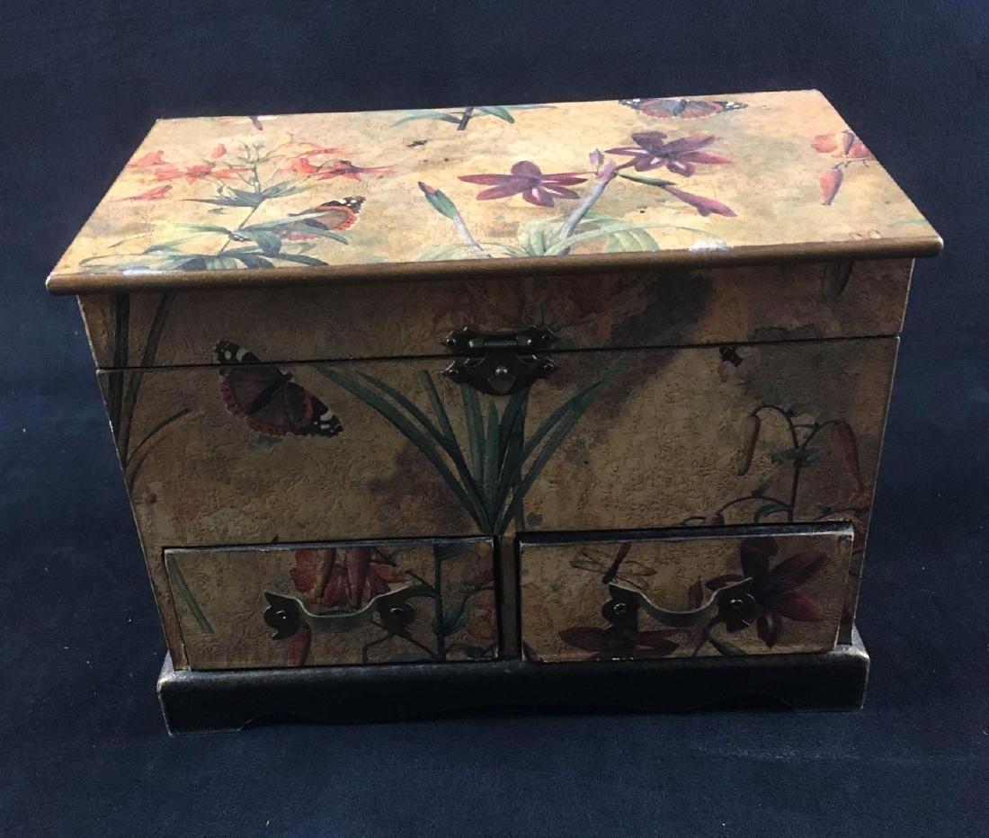 Butterfly Wooden Jewelry Box: Butterfly Wooden Jewelry Box. This jewelry box is in great condition. The box has a spackled/distressed texture with a butterfly and plant design. Interior is black wood. Jewelry box has a clasping to