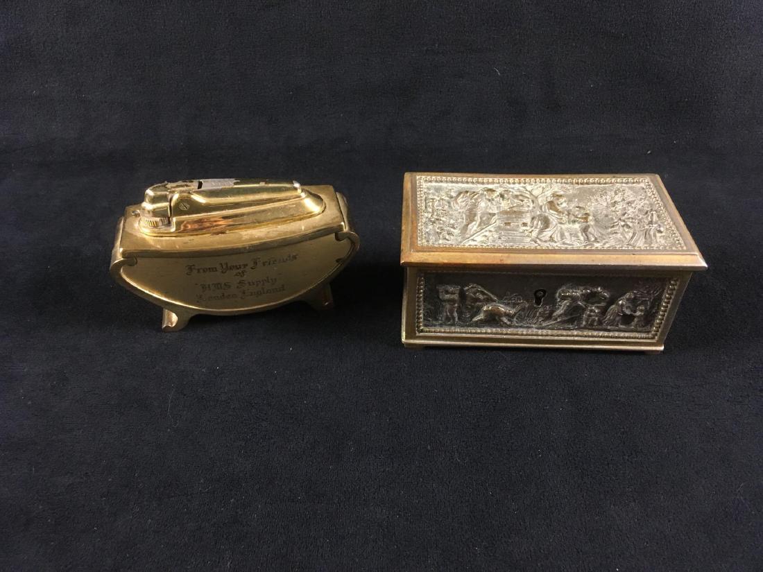 Vintage Ronson Table Lighter and Embossed Trinket Box: Vintage Ronson Table Lighter and Embossed Trinket Box; the Ronson table lighter shows a bright brass finish and is engraved "From Your Friends of HMS Supply London England". It is marked "Made in Engl