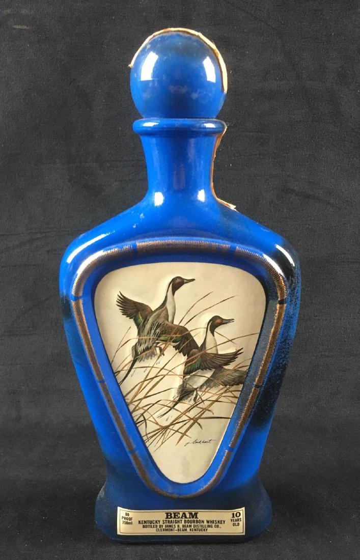 J. Lockhart Beam Kentucky Straight Bourbon Whiskey: J. Lockhart Beam Kentucky Straight Bourbon Whiskey Bottle. This bottle is in used condition. Some minor paint loss as seen in the images. The bottle is blue ceramic with decal of duck painting by J. L