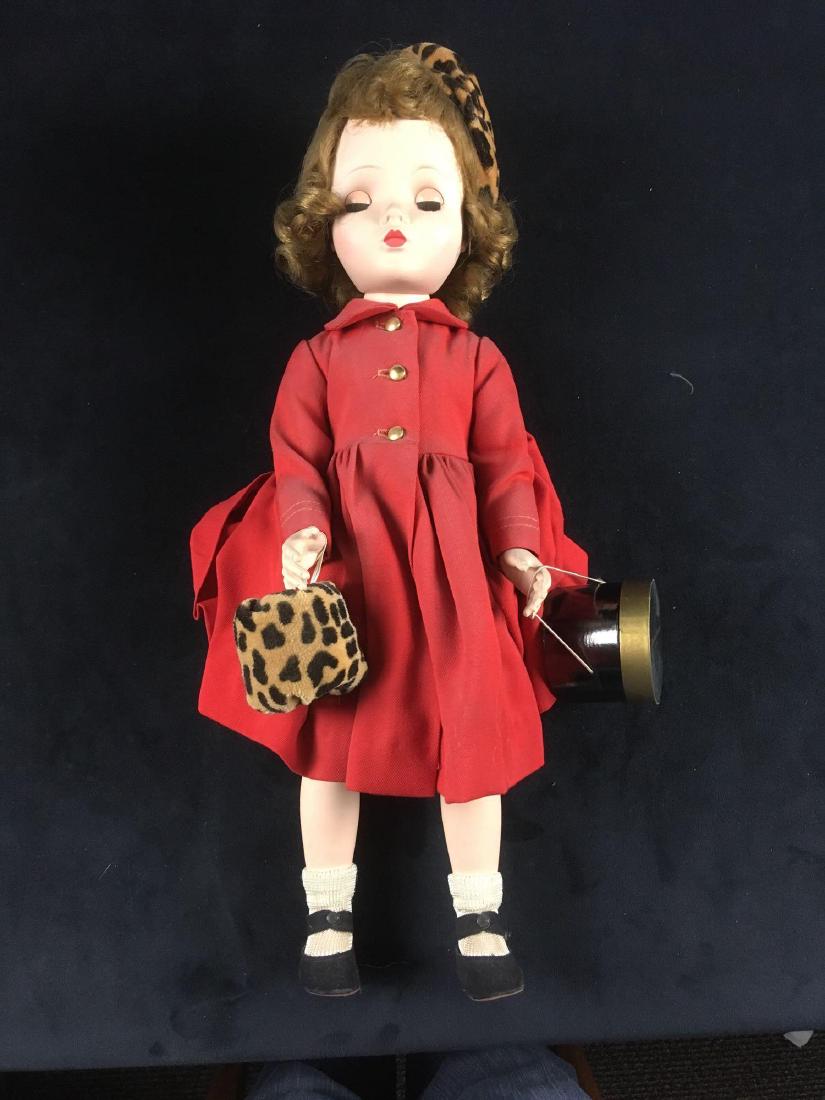 Vintage Madame Alexander Doll BinnieÂ Walker Marked: Vintage Madame Alexander Doll, Binnie Walker, Marked; Binnie appears to be in her original dress, coat, hat and shoes. she carries a faux leopard skin muffler and a hat box. In the hat box is her