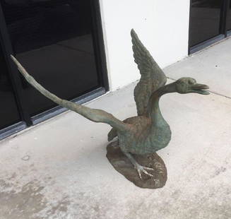 Antique Cast Bronze Garden Sculpture of Swan Taking: 1800's Large Cast Bronze Garden Sculpture of Swan Taking Flight; a very large and substantial bronze sculpture. It appears to be a mute swan preparing for flight. The workmanship is well executed show