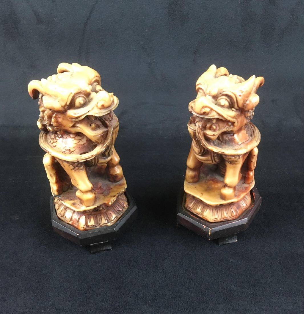 Vintage Chinese Foo Dog Statues: Pair of tourist grade, resin Foo Dogs on pedestals. Both are just under 5" tall without the base.