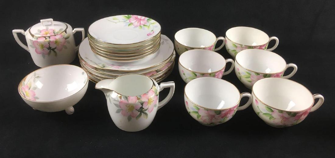 23 Hand Painted Nippon Partial Tea Set: 23 Hand Painted Nippon Partial Tea Set. This set is in good condition. There are some tiny cracks around the rims in a few of the pieces. This set includes: 6 teacups- 3.75" D x 2.5" H 1 sugar bowl- 3