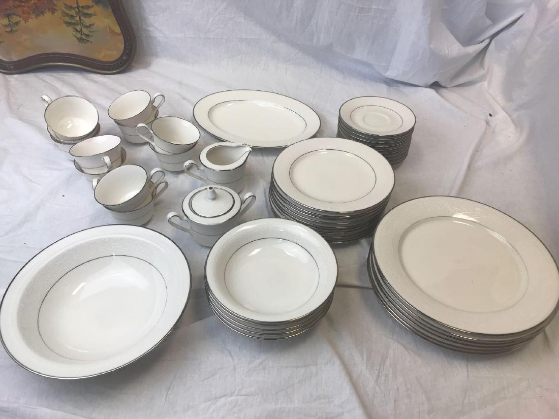 Noritake Sorrento China Lot 47 pcs: Sorrento pattern, consisting of 6 Dinner Plates, 10 Salad Plates, 5 Soup Bowls, 2 Pieces, Sugar with Lid and Creamer, 11 Coffee Cups and 10 Saucers. There is normal wear but no known chips or cracks.