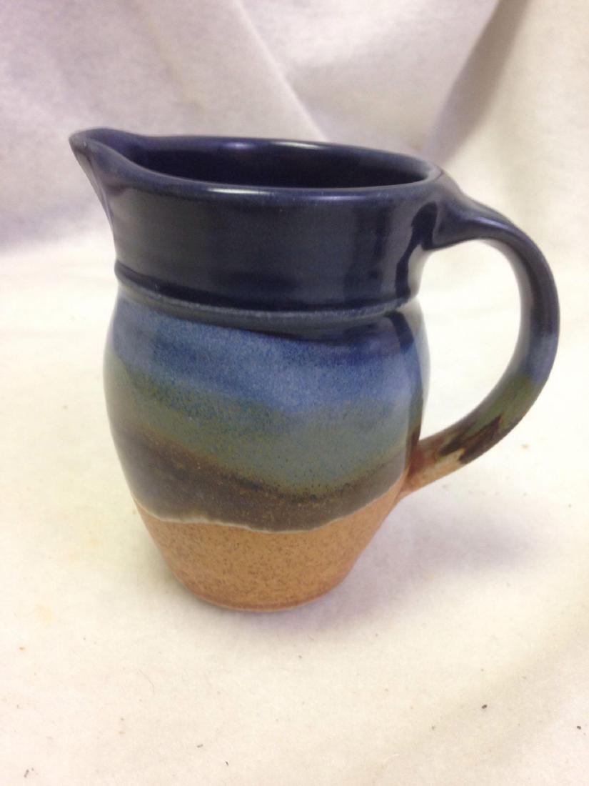Coffee Creamer Sunset Canyon Pottery Stoneware: Here is a fun piece of stoneware clay pottery. Â It was made by a true craftsperson/artisan at Sunset Canyon Pottery in Colorado. Â The colors are wonderful and look inspired by the painted desert