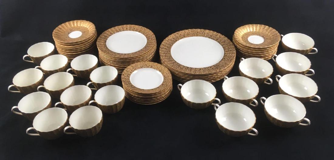 Royal Worcester Ripple Bone China Set: Royal Worcester Ripple Bone China Set. This set is in good condition overall. It has gold flecks on a matte gold background and white porcelain. The set contains: Dinner plates - 8 total (10.25" D)Â�