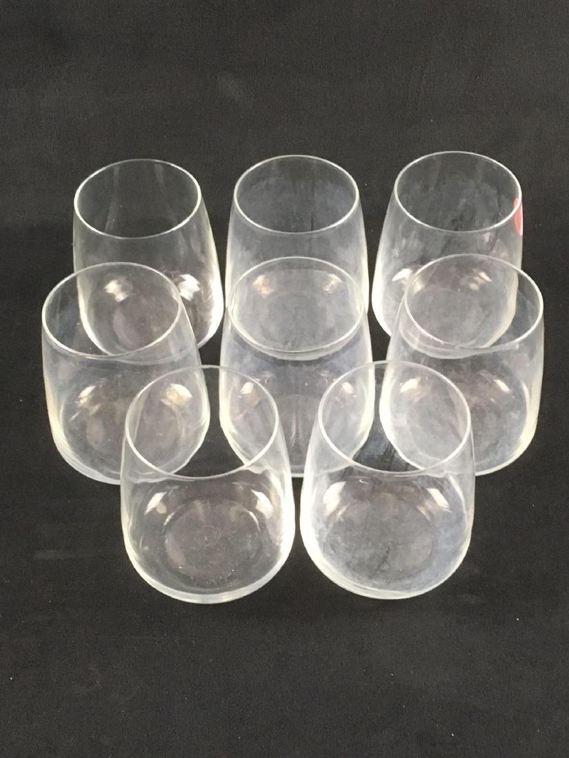 Set of 8 Stemless Wine Glasses: Set of 8 Stemless Wine Glasses; all are in very good condition with no chips or cracks noted. It is noted that 7 of the 8 show a cloudy film, probably from hard water rinse in a dishwasher. It is expe
