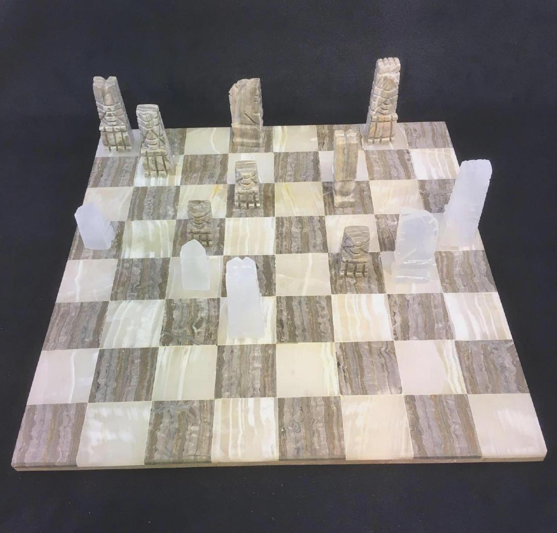 Vintage Hand Carved Onyx Chess Set from Mexico: Vintage Hand Carved Onyx Chess Set from Mexico; this set is complete with 32 playing pieces and board. The pieces are carved from white and gray marbleized onyx. All is in excellent condition, there a