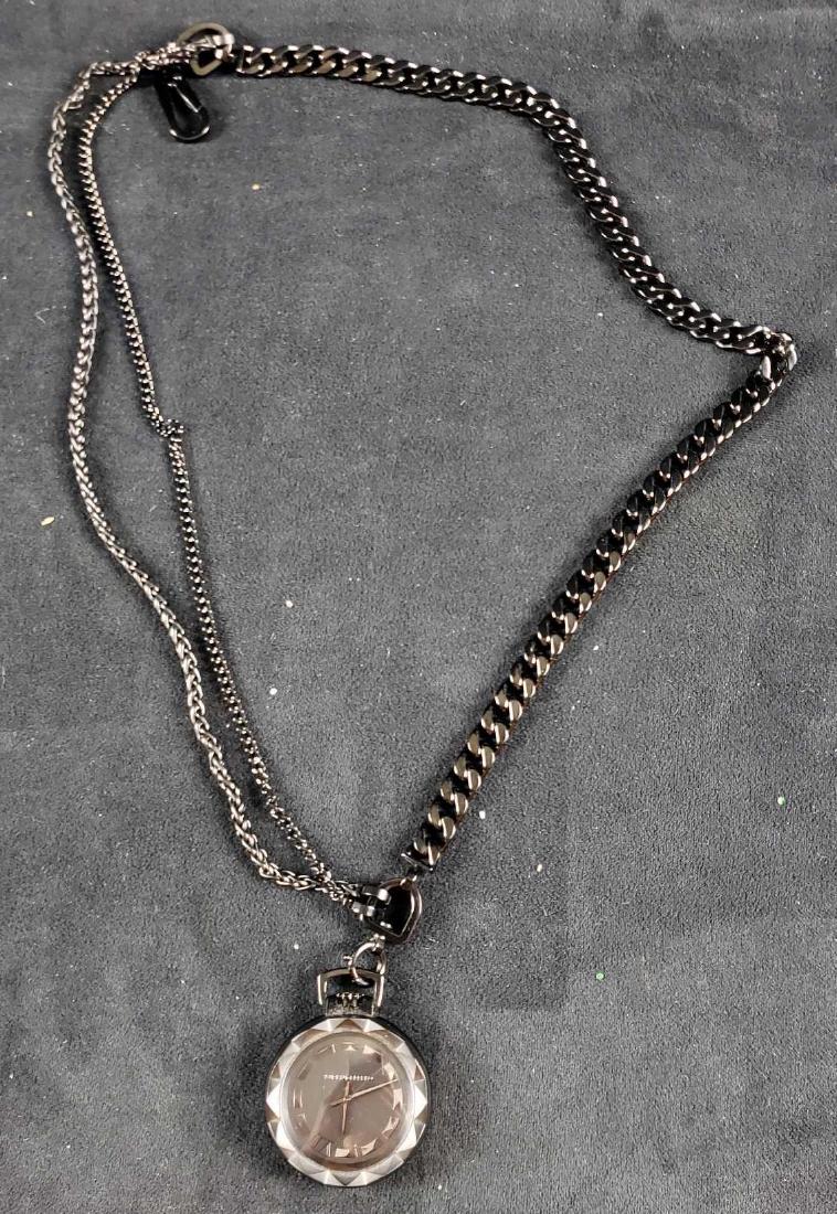 Karl Lagerfeld Pocket Watch: Good Used Condition Black Face and Black Trim with a Black Chain. Has not been tested.Â May need a new battery.