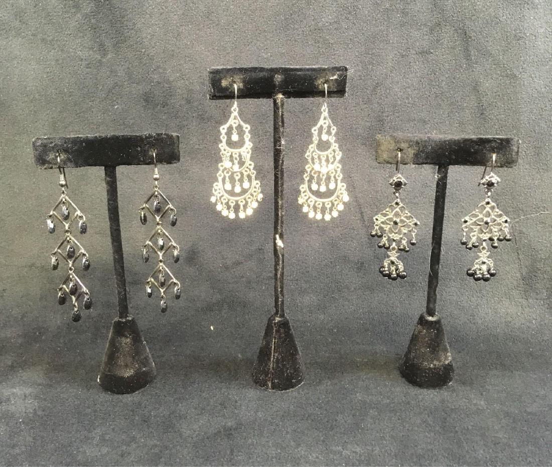 Chandelier Gothic Style Earring Collection: Chandelier Gothic Style Earring Collection; This collection includes a total of 3 pairs of earrings, each similar in style. The silver earrings measure at approximately 2" L x 1/2" W, the triangle pai