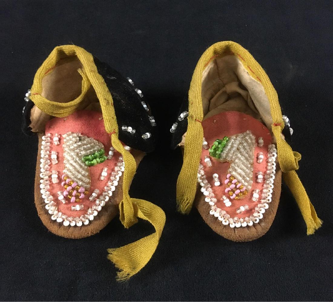 19th Century Mohawk Native American Baby Moccasins: 19th Century Mohawk Native American Baby Moccasins; These are an authentic pair of handmade Mohawk Native American moccasins made with glass beads They are in great condition and measure at approximat