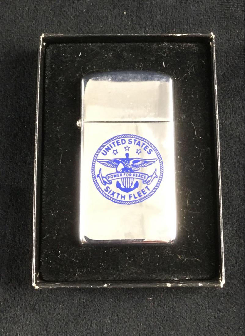 Military Memorabilia, Zippo Lighter Marked United State: Military Memorabilia, Zippo Lighter Marked United State Navy Sixth Fleet; on the reverse, this lighter is marked "Presented by Commander Sixth Fleet". The lighter is in very good condition with the on