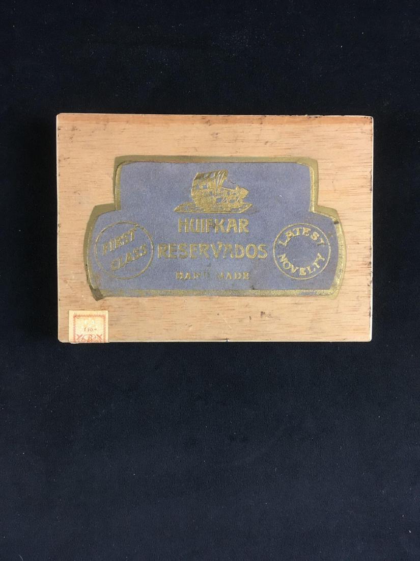 Collectible Huifkar Cigar Box: CollectibleÂ Huifkar Cigar Box; from the famous cigar maker in The Netherlands. It shows a Spanish cedar bottom and is in very good condition. It measures 8" W x 5 3/4" D x 1" H.