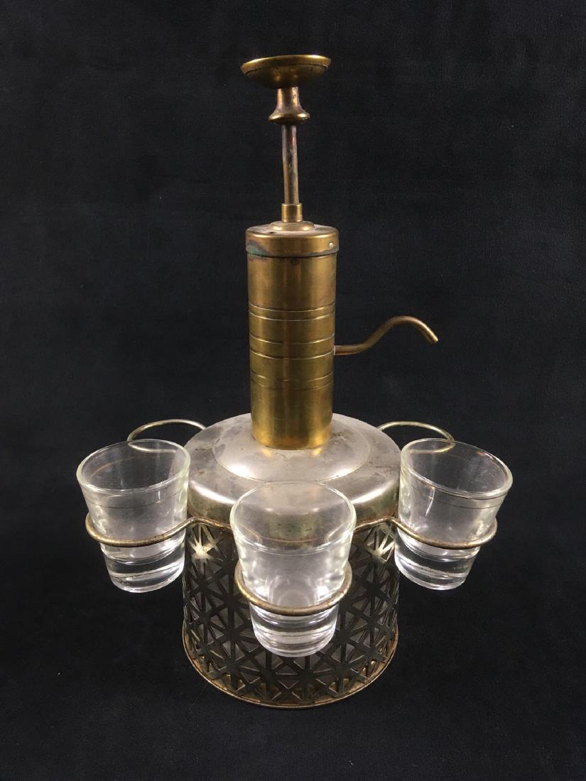 Vintage Bar Ware Pump Brass and Glass Pump Dispenser: Vintage Bar Ware Pump Brass and Glass Pump Dispenser and Shot Glasses. This dispenser is in fair condition, It is slightly tarnished and missing three shot glasses. Pump dispenser measures 12" H and 5