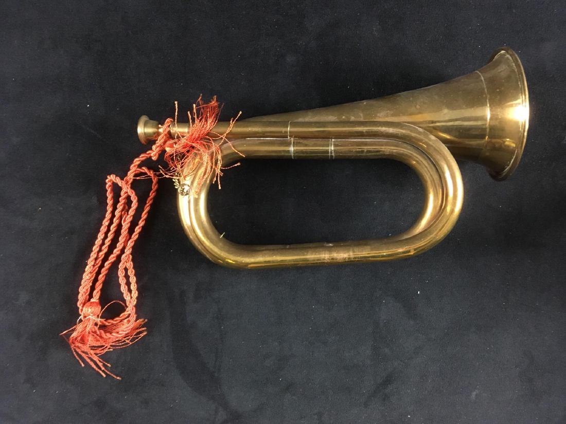 Vintage Military Brass Cavalry Bugle: Vintage Military Brass Cavalry Bugle; a very nice brass double loop cavalry bugle. It shows a cord lanyard attached. The mouthpiece is on a brass safety chain. It is in very good condition showing onl