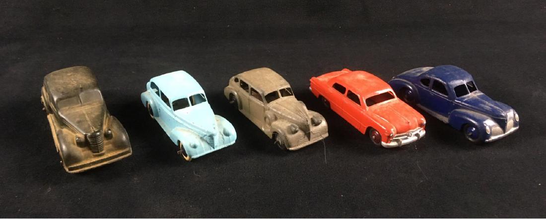 Lot of 5 Vintage Toy Cars Auburn Rubber and Dinky Circa: Lot of 5 Vintage Toy Cars, Auburn Rubber and Dinky, Circa 1940's and 50's; lot includes, 1) Auburn Rubber Corporation 1940's Sedan with suicide doors, 2) Dinky Oldsmobile #39B, possibly repainted, 3) 