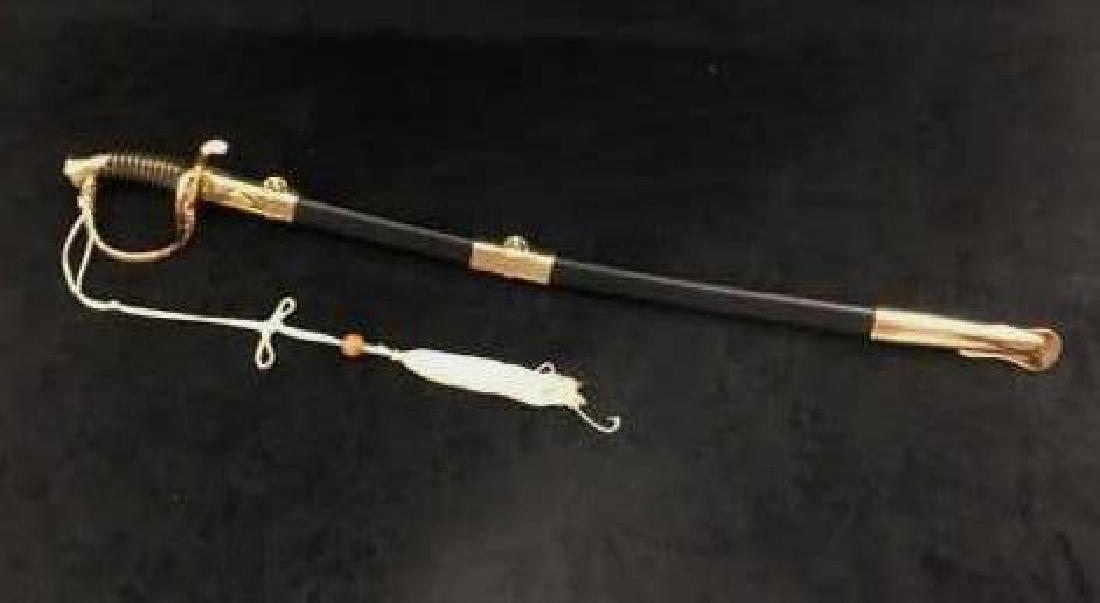 Re-enactors Confederate Officers Sword: Re-enactors Confederate Officers Sword; this saber style sword shows a brightly polished brass hilt, the scabbard shows bright brass colored chape and suspension ring mountings. The blade shows much d