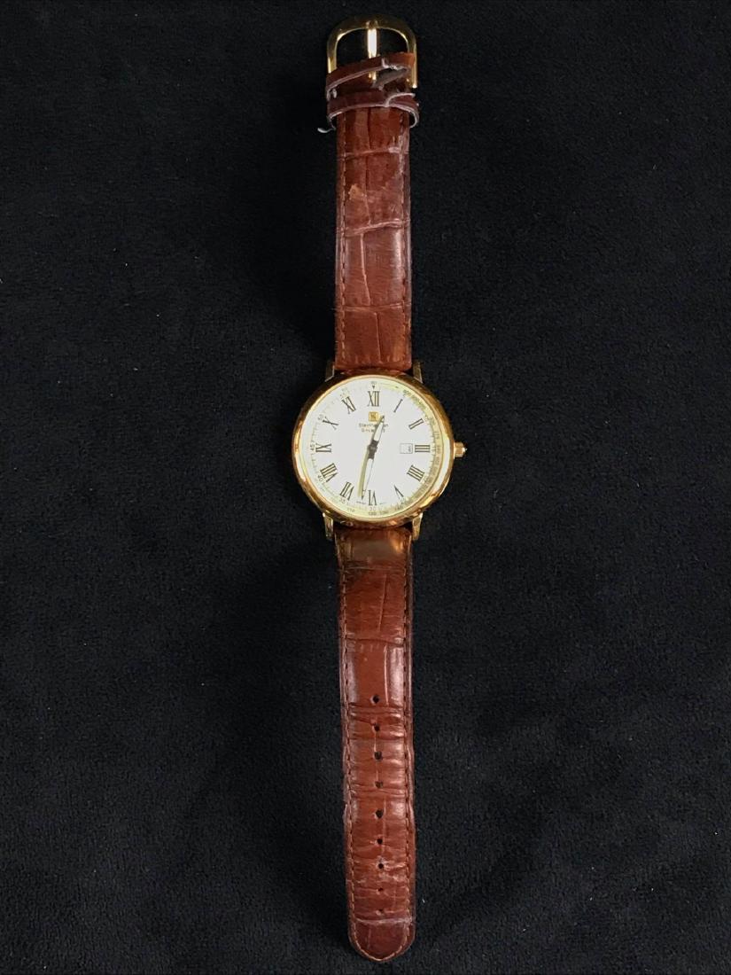 Steinhausen Mens Dunn Analog Thin Gold Calender Watch: ThisÂ Steinhausen Men's Dunn Analog Thin Gold Calender Watch with genuine leather strap is in great used condition with a very minor scratch on face (does not show up in an image). Swiss design and 
