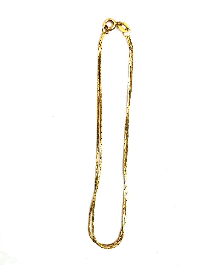 14K Gold 2 Strand Bracelet: 14K Gold 2 Strand Bracelet; This gold bracelet features a double chain that has a classic elegance to it. It measures at approximately 7 1/4" L.Â Weight: 1.35 grams.