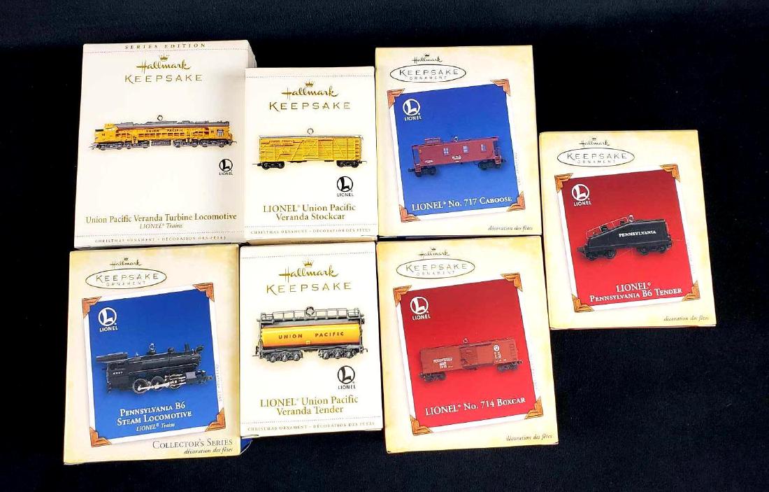 Lot of 7 Hallmark Keepsake Lionel Train Ornaments: Lot of 7 Hallmark Keepsake Lionel Train Ornaments. This lot of ornaments is new old stock. The items are in the original boxes with packaging. Items are die cast metal and handcrafted from 2006. The i