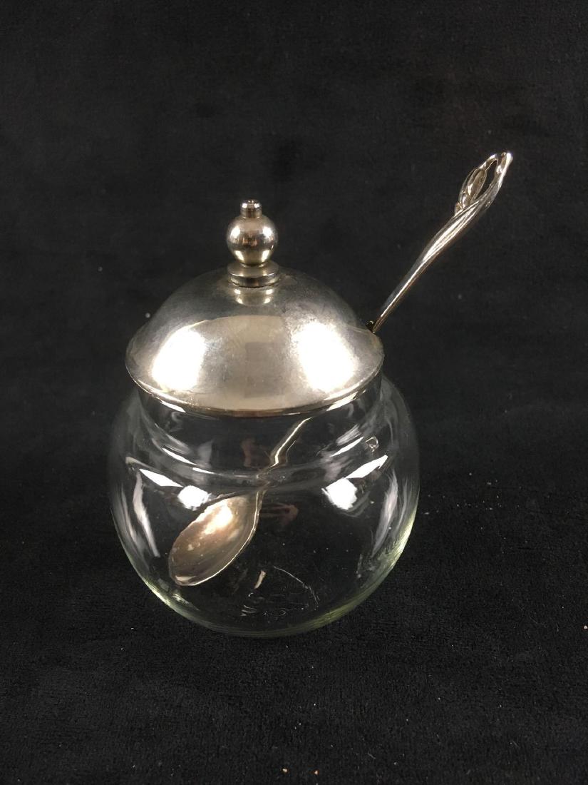 Vintage Glass and Plated Silver Condiment or Jelly Jar: Vintage Glass and Plated Silver Condiment, Jelly Jar and Spoon; a very nice clear and clean piece. The spoon shows a nice duck motif at the tip of the handle. All is in excellent condition. The jar wi
