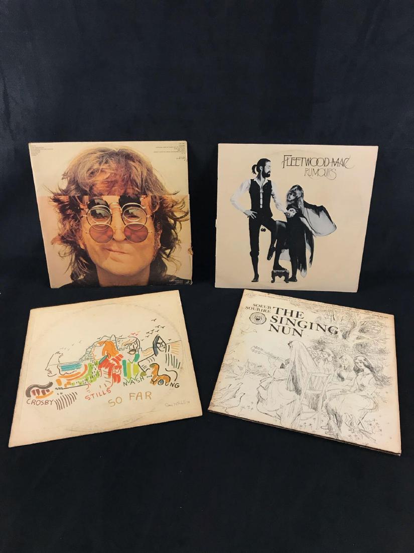 Vintage Vinyl Collection John Lennon Joni Mitchell And: Vintage Vinyl Collection John Lennon Joni Mitchell And More; This collection includes John Lennon's Bridges and Walls, Fleetwood Mac's Rumors, Soure Sourie The Singing Nuns. Each are in good condition