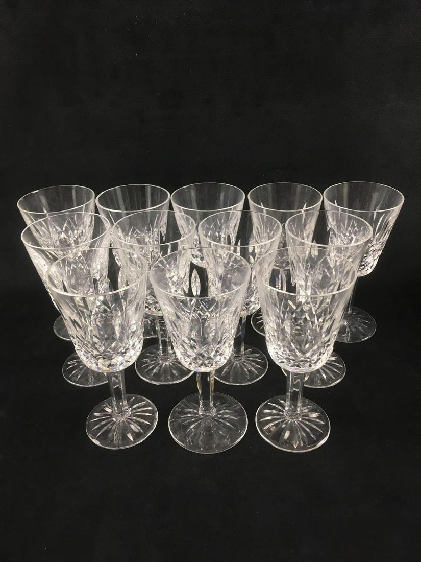 Waterford Crystal Lismore White Wine Glasses: 12 Signed Waterford Crystal Lismore White Wine; All glasses are in excellent condition and are signed. Each measure at about 5 1/2" H x 2 3/4" D.