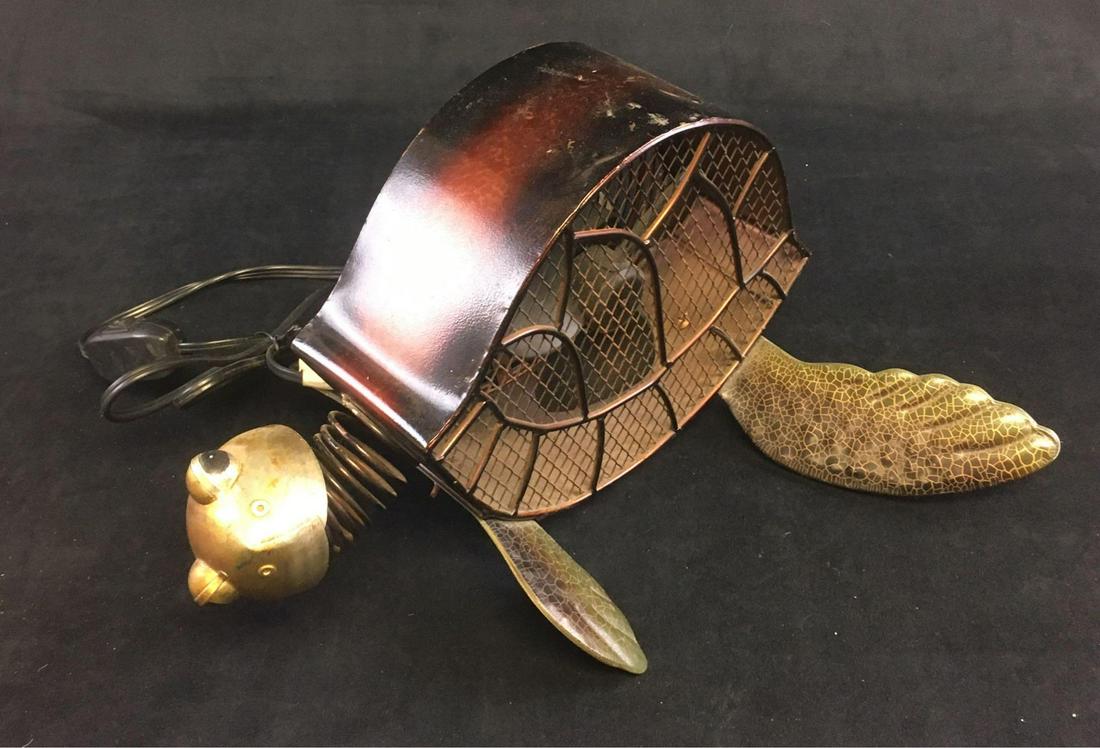 Unique Sea Turtle Figurine Fan by Deco Breeze: Unique Sea Turtle Figurine Fan by Deco Breeze; a metal sculpture of a turtle with a small fan housed within the shell. Very fun. The fan shows two speeds, it has been tested and works. It is in g