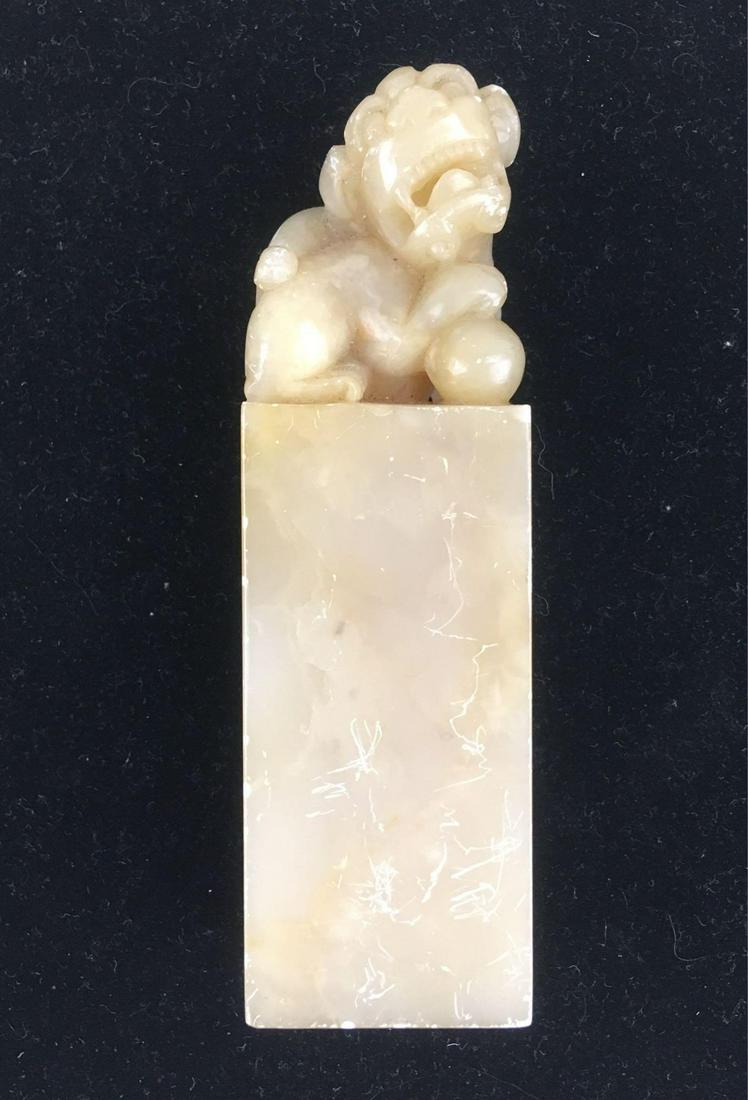 Chinese Foo Dog Soapstone Seal: Chinese Foo Dog Soapstone Seal; This is an authentic Chinese soapstone seal, otherwise known as a chop. It has some scratching and a chip on the ear, but is otherwise in good condition. It measures at