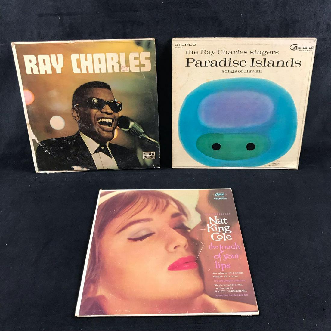 Vintage Ray Charles Nat King Cole Vinyl Collection: Vintage Ray Charles Nat King Cole Vinyl Collection; Collection includes Paradise Islands, The Touch of Your Lips. Each are in good condition.