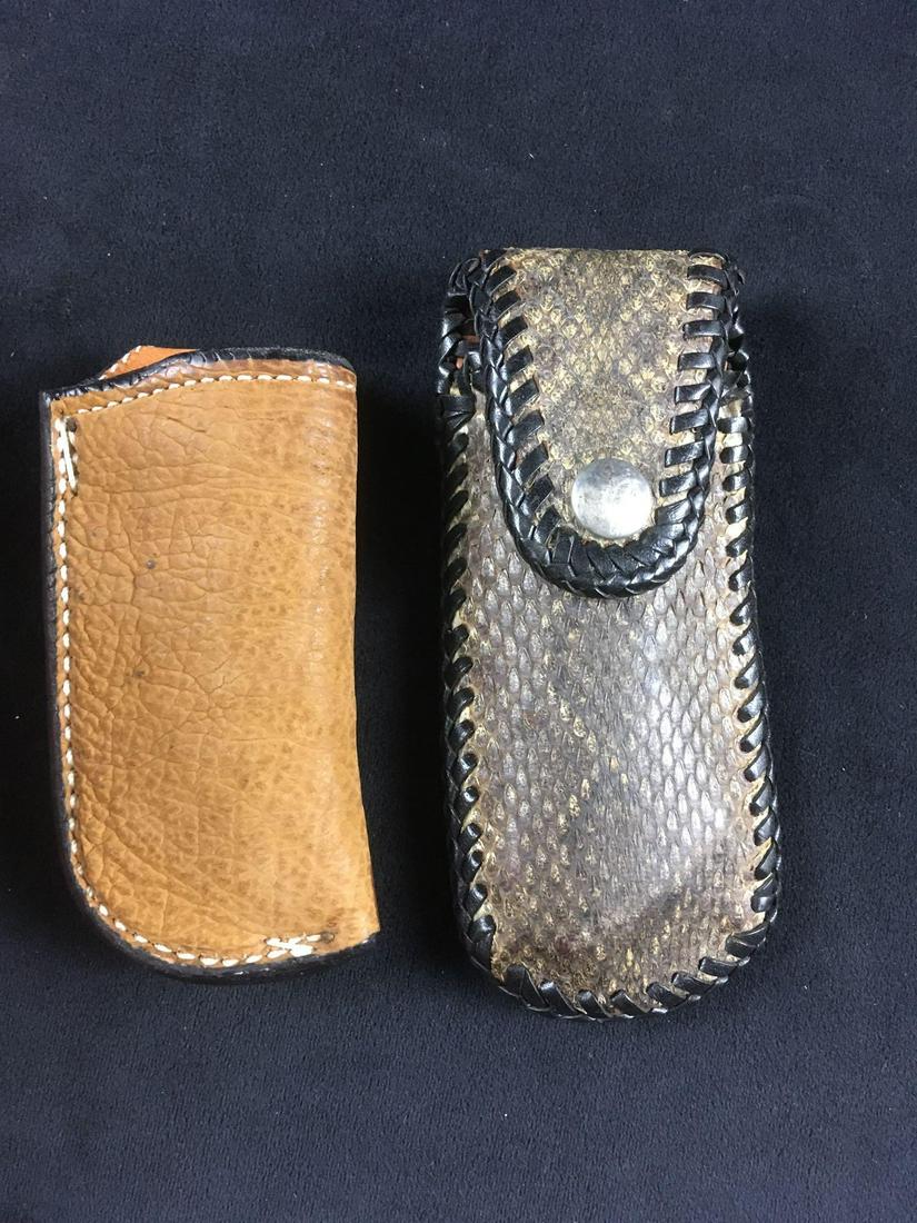2 Vintage Knife Sheaths: 2 Vintage Knife Sheaths. This set is in good condition. It contains one made of rattlesnake skin with a button and the other is leather marked "Byrd" brand. Rattlesnake skin one measures 6" in length
