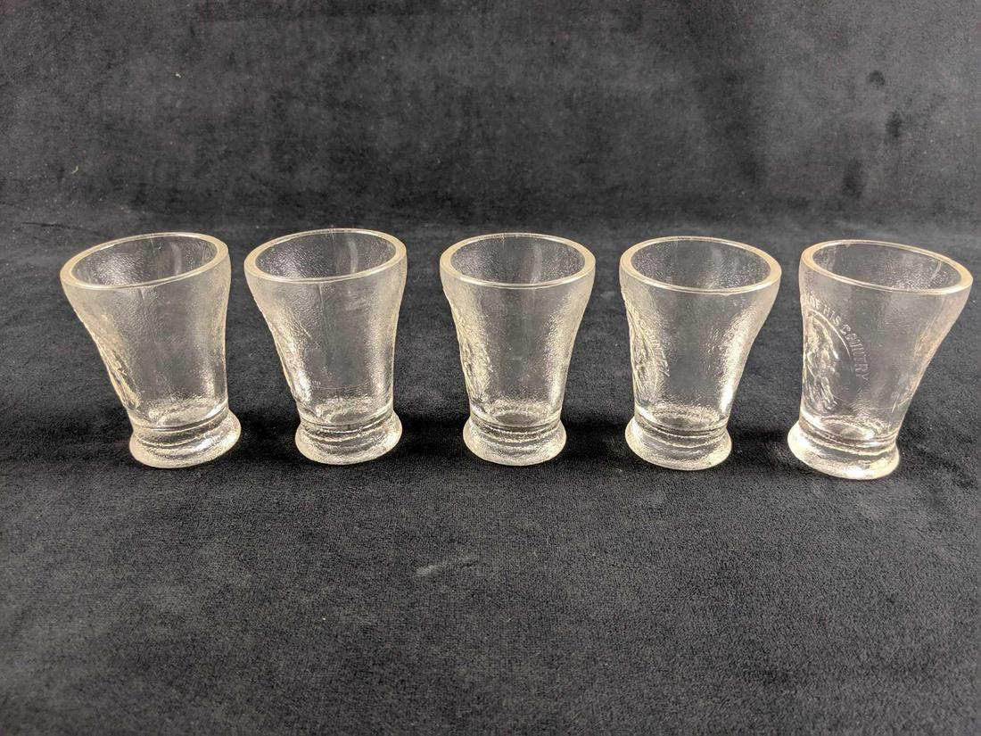 Set Of Five Father Of His Country Shot Glasses: Shot glasses have a bust of George Washington on each. Appears to be frosted glass. Light scratches on glass.