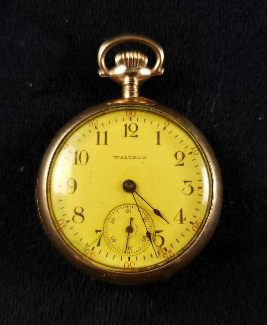 Waltham 20 Year Gold Filled Bob Royal Case Pocket Watch: Waltham 20 Year Gold Filled Bob Royal Case Pocket Watch. This pocket watch is in good condition. It has some scratches on the back. Back of the watch has an inscription that reads LG. Watch measures 1