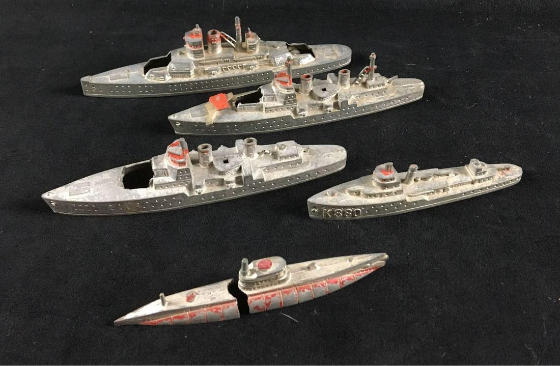 Vintage Tootsie Toy Fleet of 5 Diecast Ships: Vintage Tootsie Toy Fleet of 5 Diecast Ships; every vessel of the fleet is marked. Four ships of the fleet are in fair condition as they are missing their big guns. The one submarine appears to have h