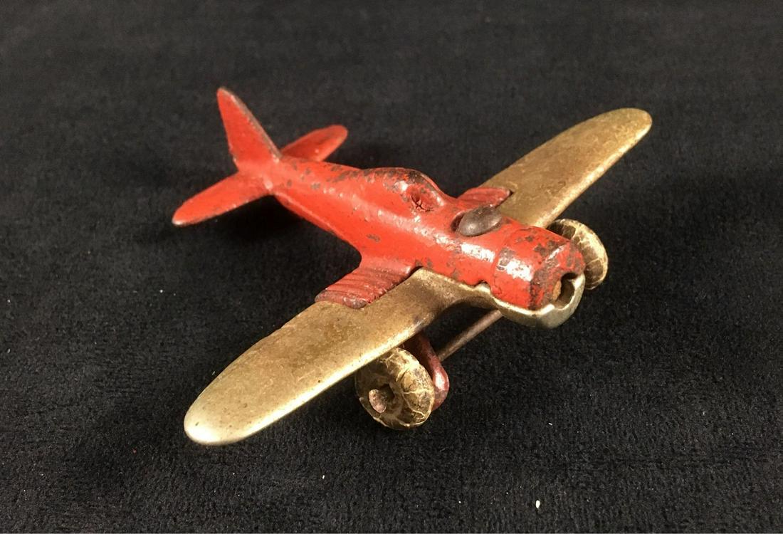 Vintage HubleyÂ Cast Iron Toy Airplane 2227: Vintage HubleyÂ Cast Iron Toy Airplane 2227; a fine example of this HubleyÂ toy from the 1930's. It is in good condition, note it is missing the prop. The toy measures 4" W x 3" L x 1 1.4" H.