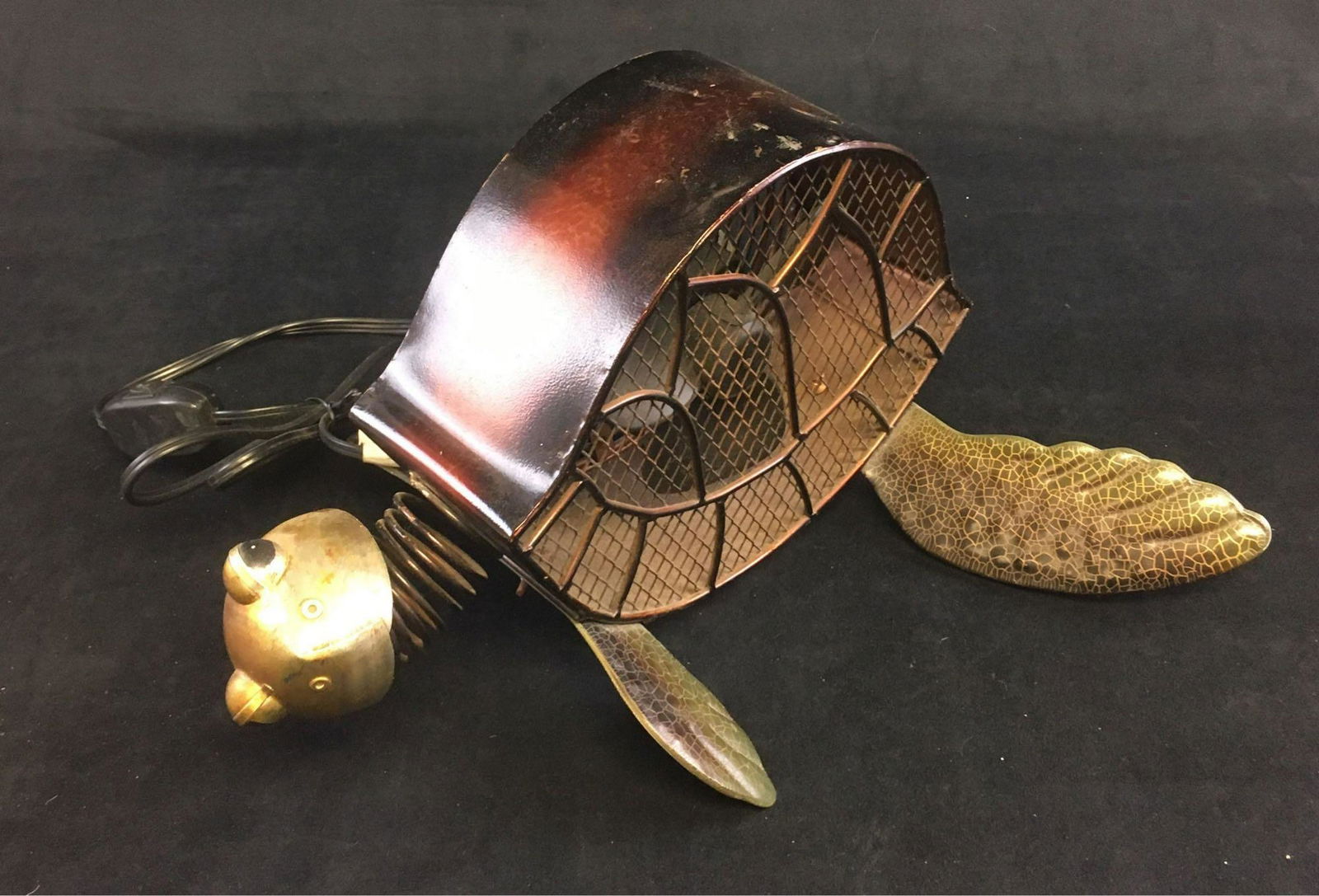 Unique Sea Turtle Figurine Fan by Deco Breeze: Unique Sea Turtle Figurine Fan by Deco Breeze; a metal sculpture of a turtle with a small fan housed within the shell. Very fun. The fan shows two speeds, it has been tested and works. It is in g