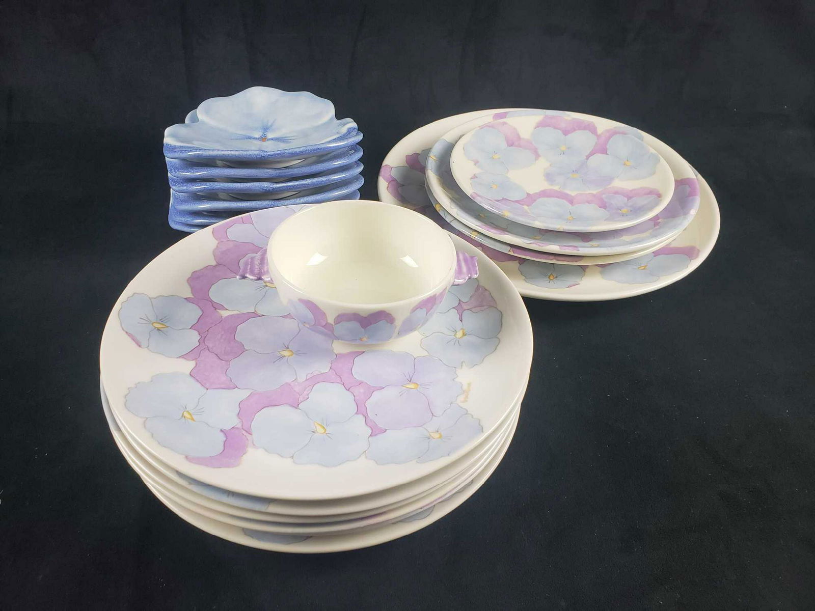 Ernestine Salermo Italian Pansy Ceramic Dinnerware Set: Ernestine Salermo Italian Pansy Ceramic Dinnerware Set. This set is in very good used condition. The pieces have a beautiful hand painted pansy design and the backs are marked Italy and have the artis