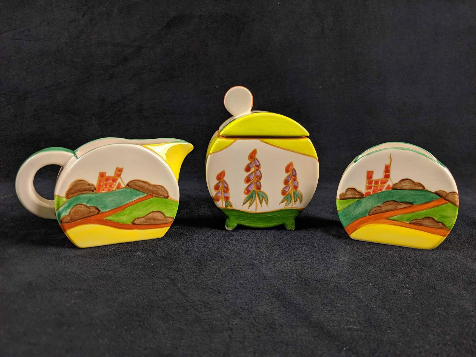 Clarice Cliff Bizarre MMA 1993 Repro Lot of 3: This Lot is for a 3 piece vintage reproduction of the work of artist Clarice Cliff's "Bizarre" collection created for the Museum of Modern Art in 1993.Â 1 Clarice Cliff vintage reproduction creamer