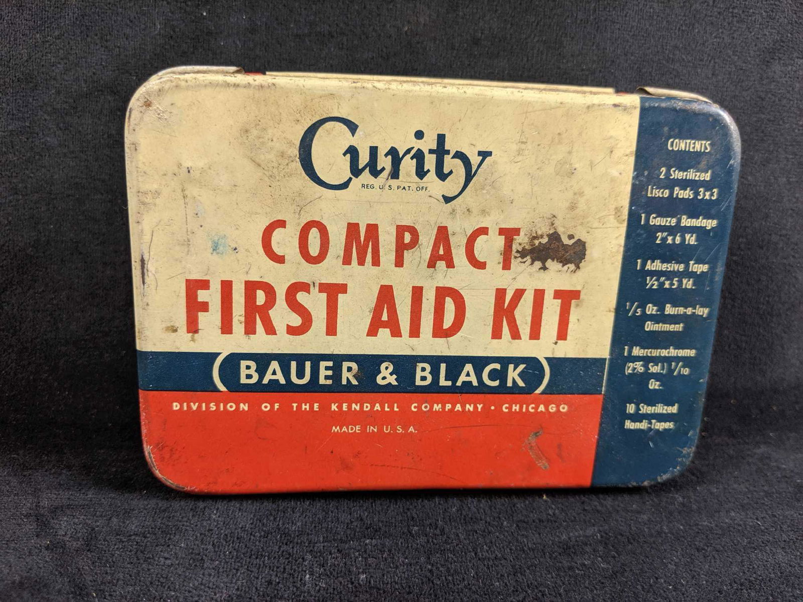 Vintage Curity Bauer and Black Automobile First Aid Kit: Vintage Curity Bauer and Black Automobile First Aid Kit, from the Kendall Company, classic tin. Comes with an assortment of medical supplies, from original Curity adhesive tape, original instructions,