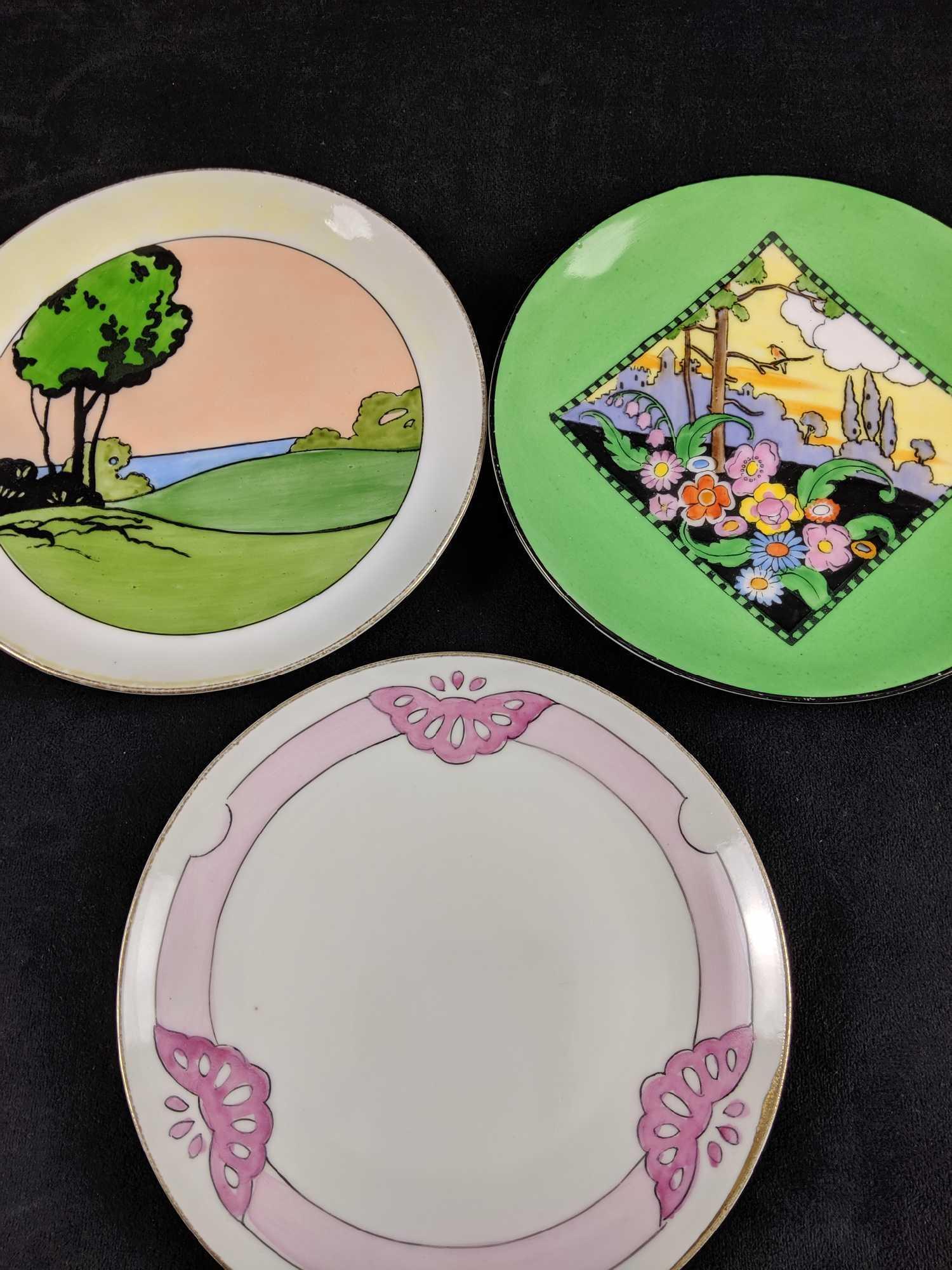 Art Deco Porcelain Plates Lot of 3: 1 Art Deco pink butterfly pattern by Royal Nippon. This plate has thin 2" crack (Please see pictures). The gilded edge has rubbed off due to normal wear and tear. This plate has a diameter of 6". 1 No