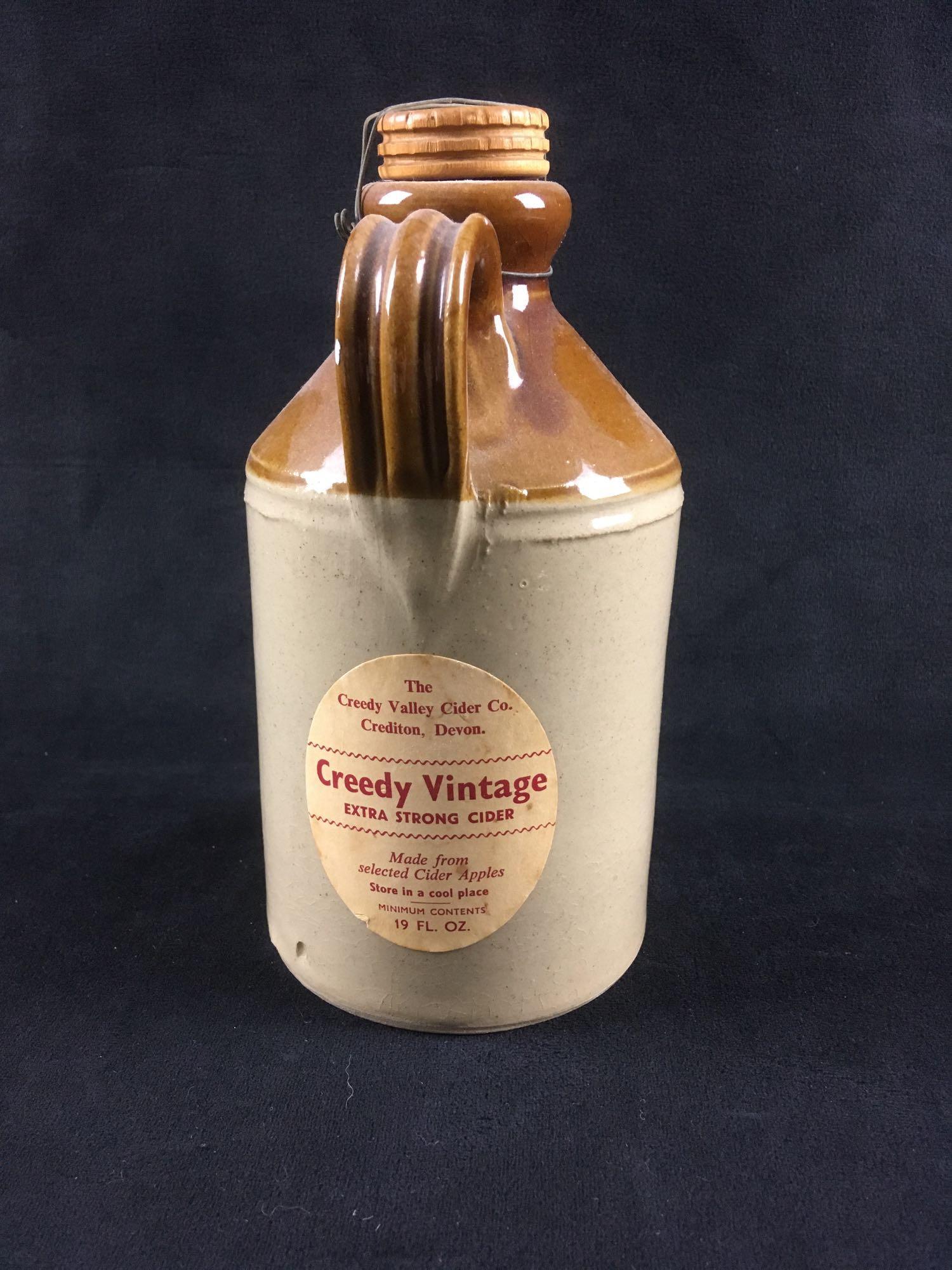 Vintage English Cider Jug from Cornwall: Vintage English Cider Jug from Cornwall; on the face, this glazed earthenware jug is marked "Creedy Vintage Cider". The reverse shows the original label marked "The Creedy Valley Cider Co. Credtion, D