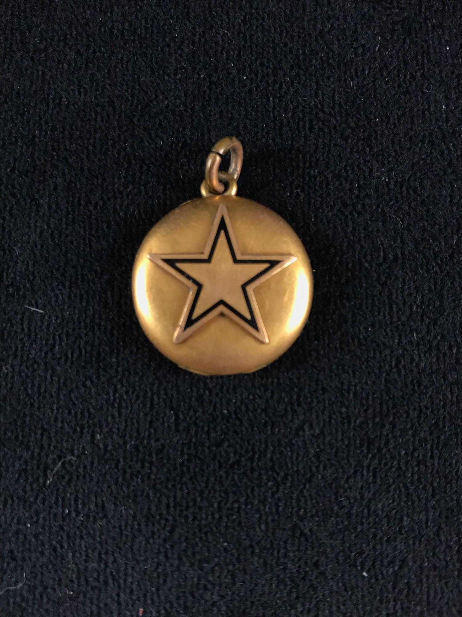 Vintage Gold Toned Star Locket: Vintage Gold Toned Star Locket; has photo inside and the star is broken, but easily fixable. Some expected tarnishing and some minor scratches that do not show up in photographs. It measures at about 