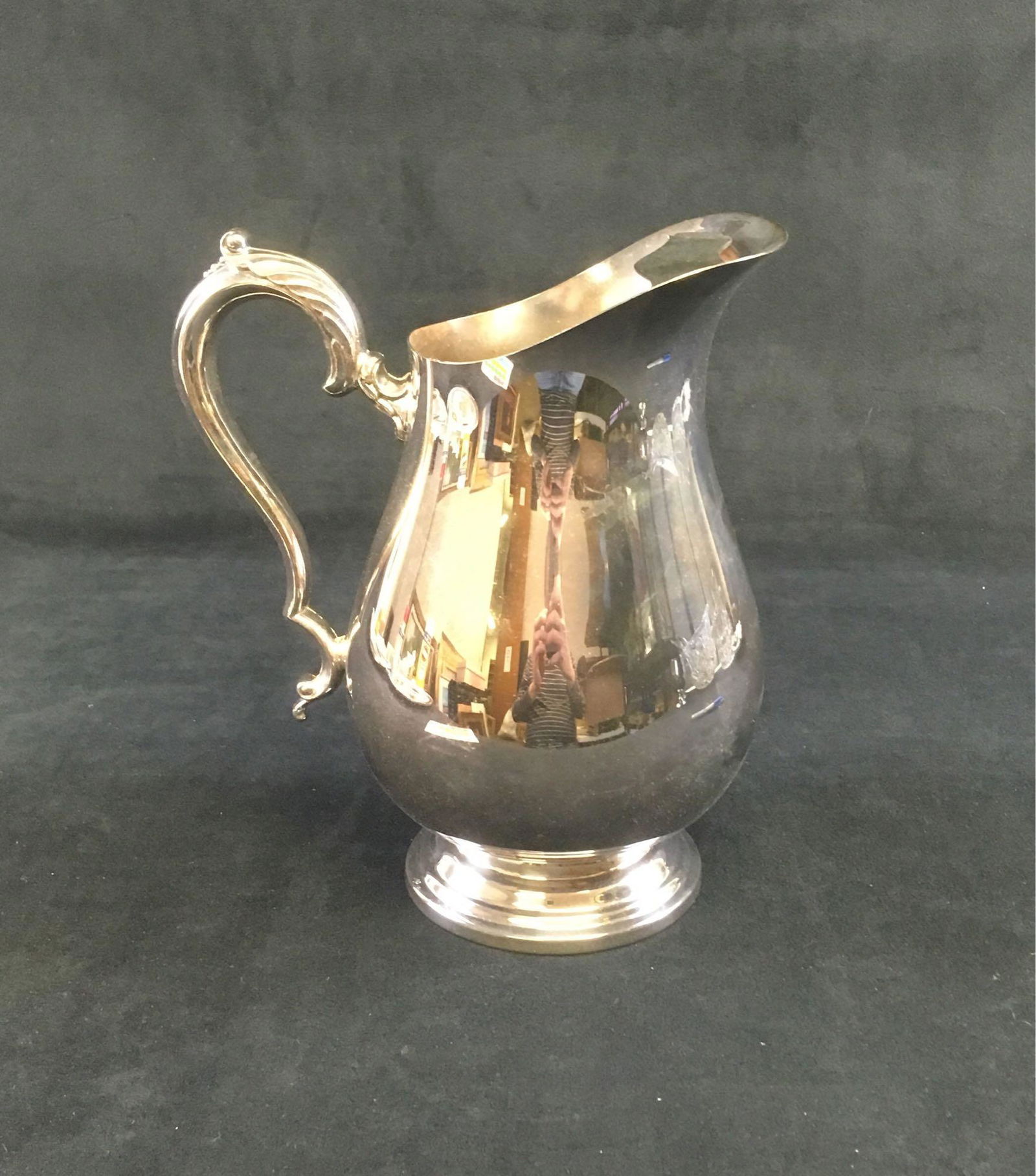 WM Rogers Silver Plated Pitcher: Silver plate pitcher, model #617, by W.M. Rogers. Item is in nice condition and measures 9" tall, with a 4.1/8" diameter base.