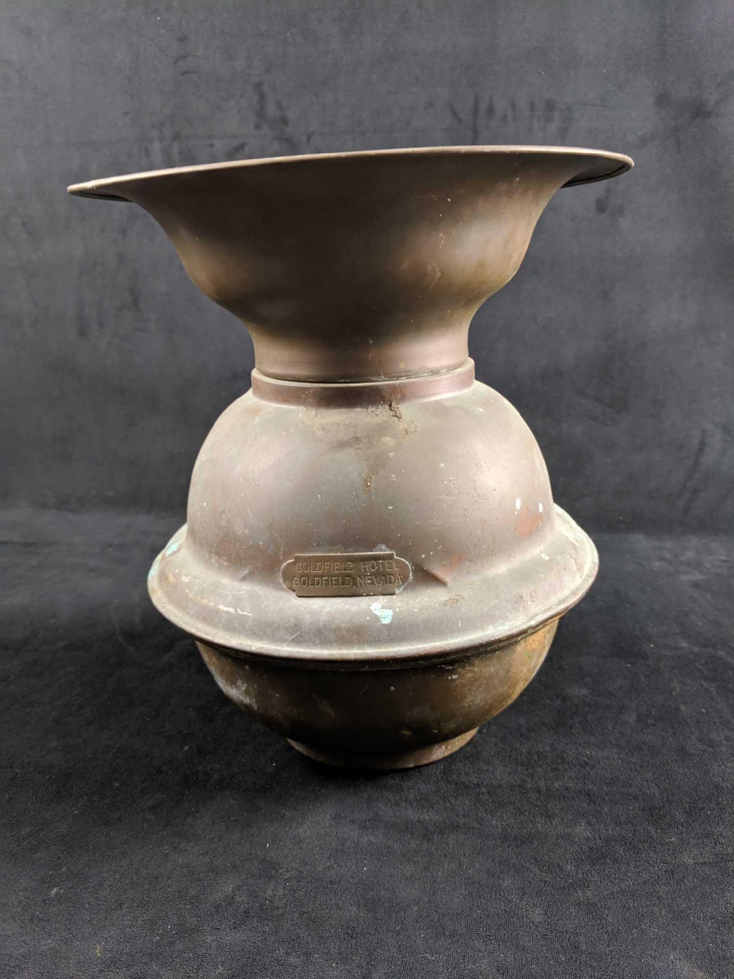 Goldfield Hotel Brass Spittoon: Well used brass spittoon from the famous Goldfield Hotel. ThisÂ Nevada tourist attraction has appeared in both film and TV and has been rumored to be haunted. Brass has signs of tarnish and insides