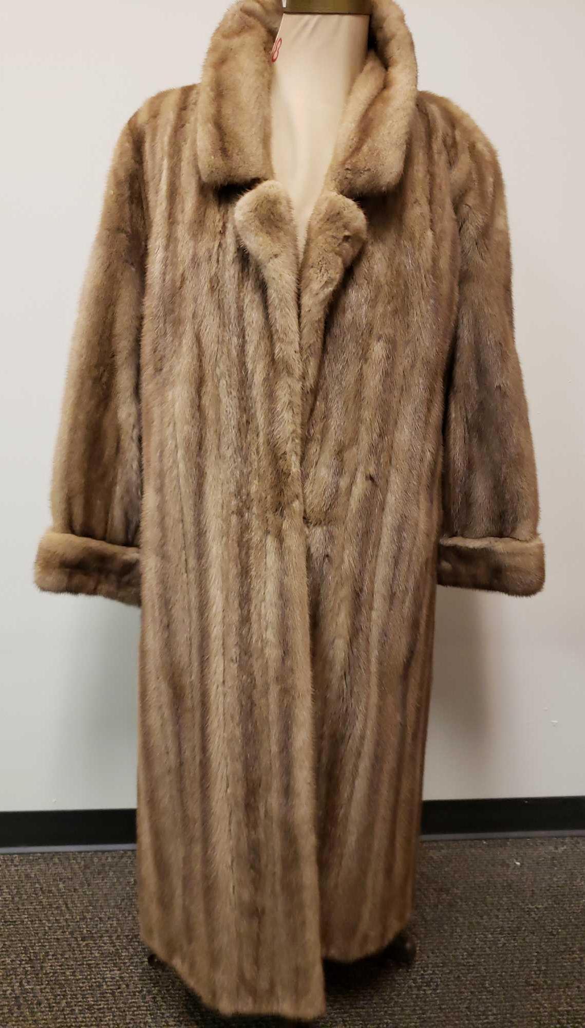 Mink Fur Full Length Coat: Mink Fur Full Length Coat. This coat is in great used condition. The coat has no known damage. The interior of the coat is grayish tan fabric. The front has a hook and loop closure. The coat is short