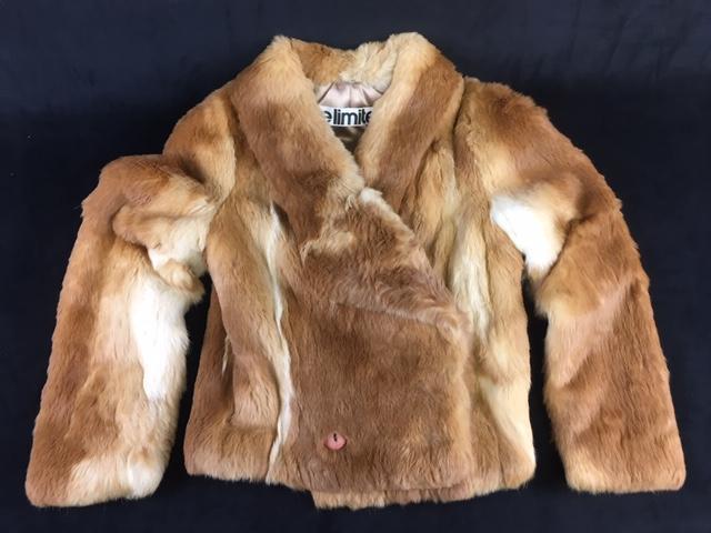 Vintage Rabbit Fur Short Jacket: Vintage Rabbit Fur Short Jacket; a very stylish short jacket of a nice tawny color, it shows a label marked "The Limited". It shows a snap in the front with a button and hole at the hem. These fasten 