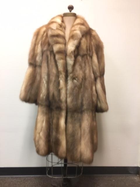 Very Fine Mid Length Stone Martin Fur Wrap Style Coat: Very Fine Mid Length Stone Martin Fur Wrap Style Coat; a very plush coat that shows deep tawny colors from dark to light. ItÂ shows a single clasp and (2) concealed front pockets. The coat is not ma