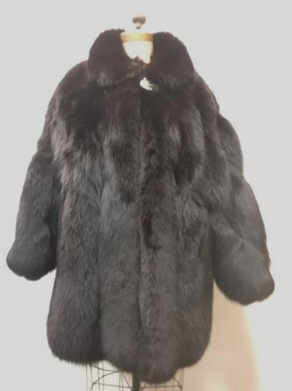 Very Fine Mid Length Black Fox Fur Wrap Style Coat: Very Fine Mid Length Black Fox Fur Wrap Style Coat; this coat has a beautiful sheen, it appears to be new old stock. The coat has a single button and loop at the collar and two (2) concealed front poc