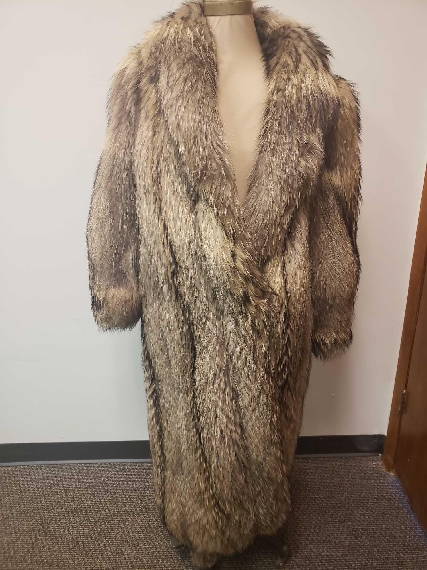 Full Length Coyote Fur Coat: Full Length Coyote Fur Coat. This fur coat is in great used condition. There are no known signs of damage on the interior or exterior. The fur is believed to be coyote fur. The interior is dark brown